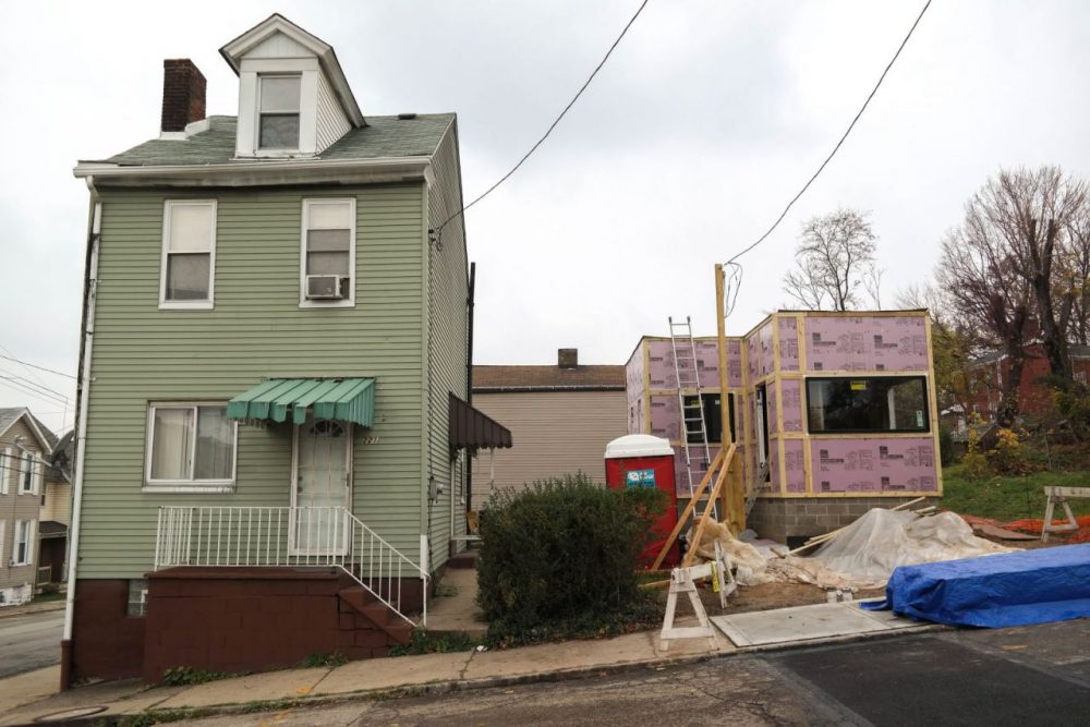 The new 330-square-foot tiny house sits next to a more conventional, neighboring house on N. Atlantic Avenue. The tiny house is being built on a lot that has been vacant for years. (Lou Blouin)