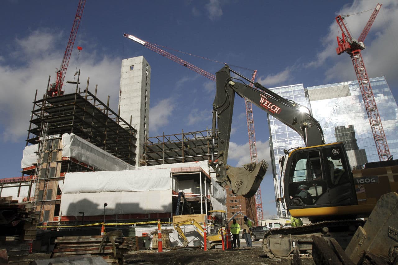 Construction takes place for three different buildings in the Seaport District Thursday, Jan. 14, 2016, in Boston. (Bill Sikes/ AP)