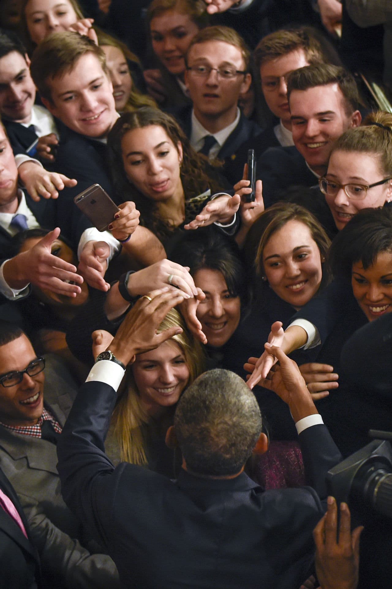 President Barack Obama is greeted after giving his final State of the Union address. (Susan Walsh/ AP)