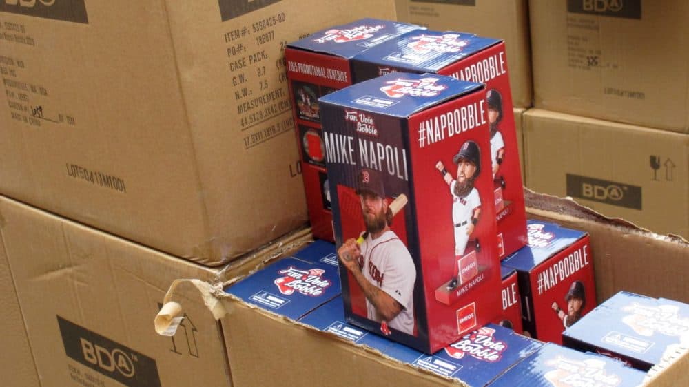 Shipping pallets piled high with Napoli bobbleheads wait at every gate. (Karen Given/Only A Game)