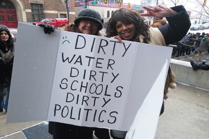 Protesters line the streets outside Detroit's Cobo Center on Thursday, January 21, 2016. Substandard conditions in Detroit Public Schools have lead district teachers to stage periodic "sick outs," shutting down much of the troubled public school district this winter. (Via @DetroitTeach / Twitter)