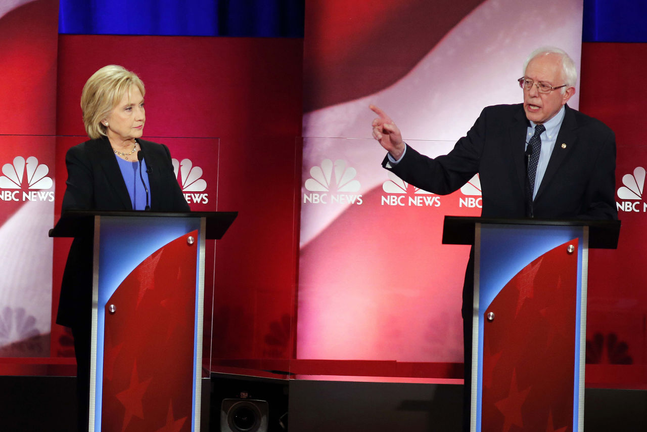 Democratic presidential candidate, Sen. Bernie Sanders, I-Vt., gestures towards Democratic presidential candidate, Hillary Clinton during the NBC, YouTube Democratic presidential debate at the Gaillard Center, Sunday, Jan. 17, 2016, in Charleston, S.C. (AP Photo/Mic Smith)