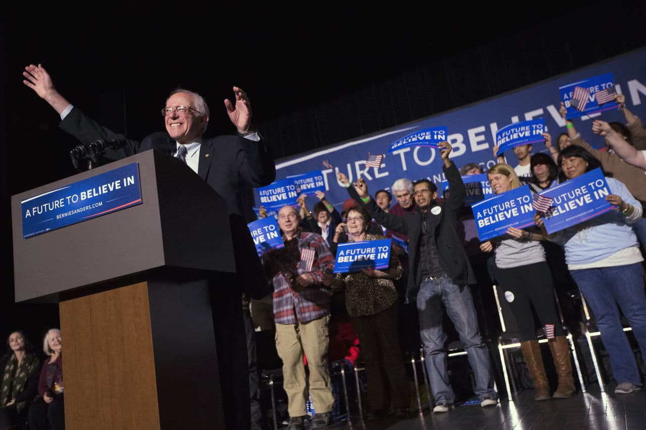 Democratic presidential candidate, Sen. Bernie Sanders, I-Vt., waves to the crowd during a campaign stop at The Colonial Theatre on Tuesday in Keene, N.H. (John Minchillo/AP)