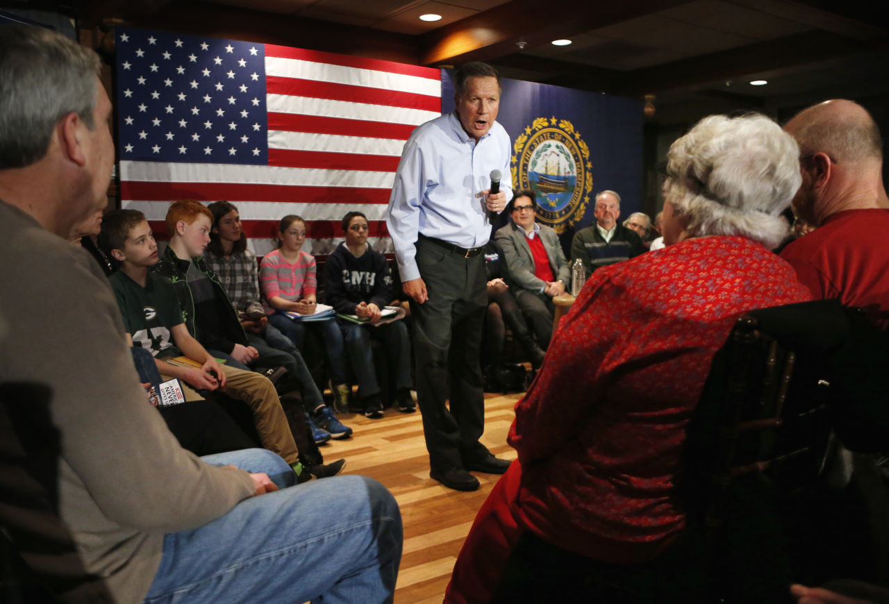 Kasich responds to a question at a town hall-style campaign event at the Three Chimneys Inn on Wednesday in Durham, N.H. (Robert F. Bukaty/AP)