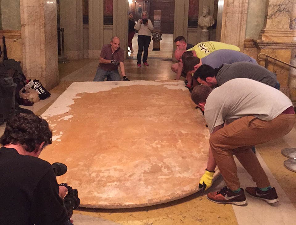 The mural is laid on the floor after it has been removed from the wall. (Courtesy BPL)