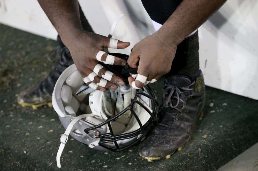 A detail shot of the hands of a football player during the game between the Tampa Bay Buccaneers and Carolina Panthers at Bank of America Stadium on January 3, 2016 in Charlotte, North Carolina. The Panthers won 38-10 to clinch home field advantage for the playoffs (Photo by Streeter Lecka/Getty Images)