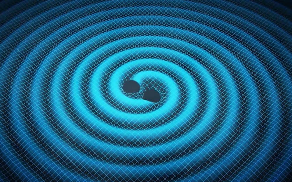 Merging black holes ripple space and time in this artist's concept. Pulsar-timing arrays – networks of the pulsing cores of dead stars – are one strategy for detecting these ripples, or gravitational waves, thought to be generated when two supermassive black holes merge into one. (Image credit: Swinburne Astronomy Productions via NASA Jet Propulsion Lab)