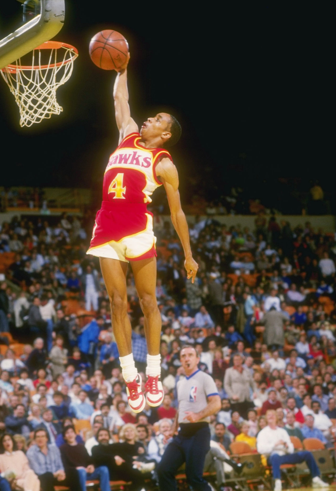 Guard Anthony "Spud" Webb of the Atlanta Hawks leaps to victory during a game against the Los Angeles Lakers at The Forum in Inglewood, California. (Stephen Dunn/Allsport via Getty Images)
