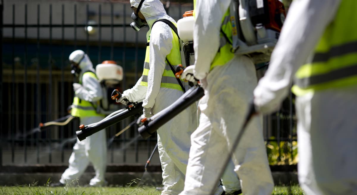 In this Jan. 27 file photo, a fumigation brigade sprays an area of Chacabuco Park in a Aedes mosquito control effort, in Buenos Aires, Argentina. The Zika virus is suspected of causing a rare but potentially devastating birth defect, an abnormally small head, which can indicate underlying brain damage. Concerns are keeping some workers from attending meetings and company retreats in affected locations but business travel experts say it does not yet appear to be having a broad impact. (Natacha Pisarenko/AP)