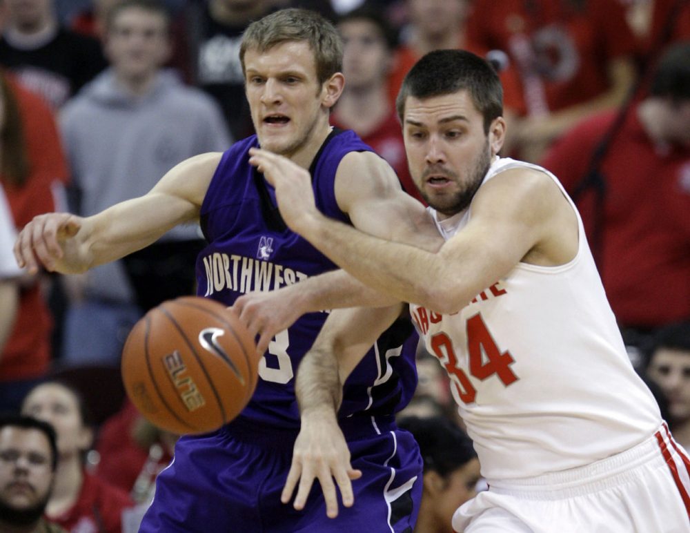Ohio State's Mark Titus, right, and Northwestern's Mike Capocci fight for a loose ball during the second half of an NCAA college basketball game Tuesday, Jan. 19, 2010, in Columbus, Ohio. Ohio State beat Northwestern 76-56. (AP Photo/Jay LaPrete)