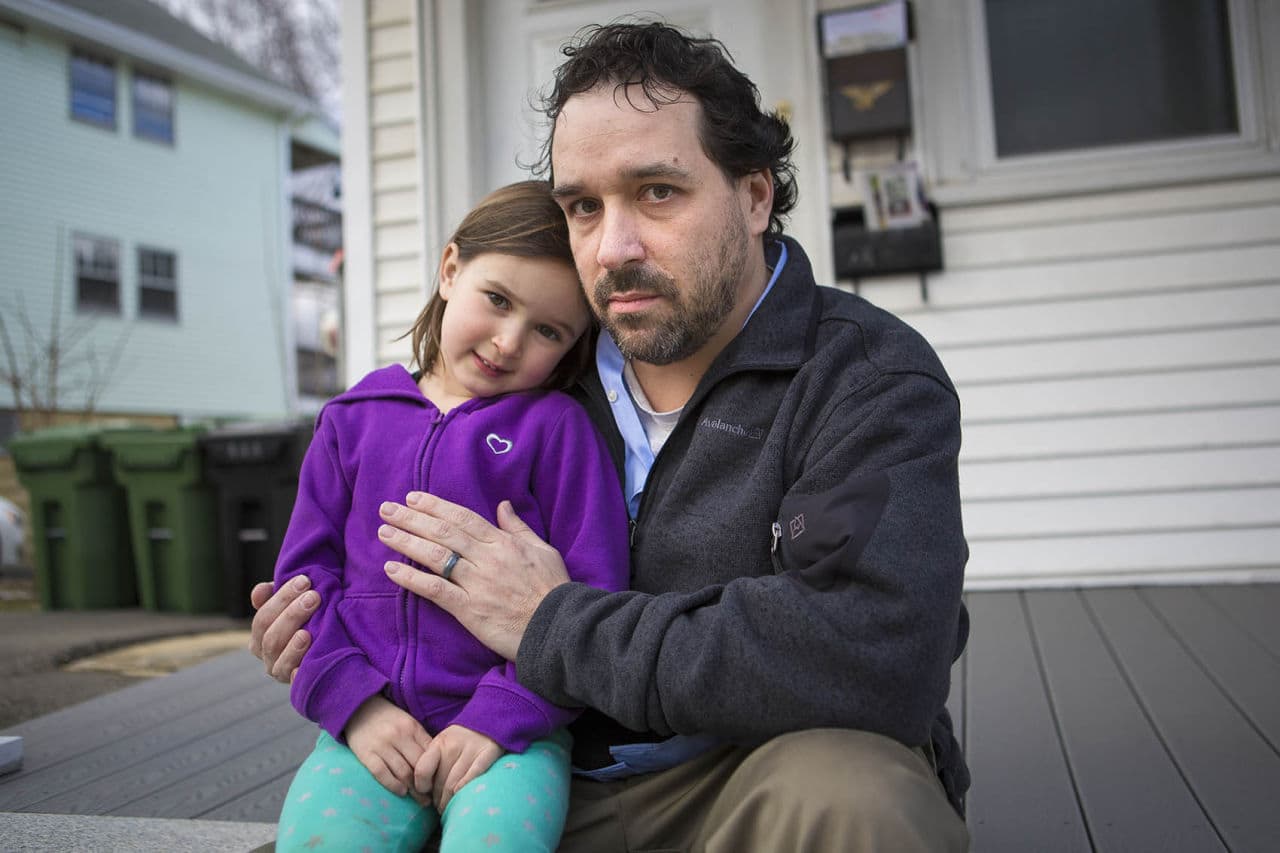 Owen Murphy with his 4-year-old daughter Marlo outside their Watertown home. (Jesse Costa/WBUR)