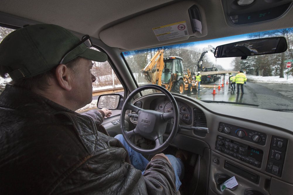 “The gas company is working right up ahead of us right now repairing a leak,” said Bob Ackley, of Gas Safety USA, as he drives a van that is equipped to detect and map methane leaks. Most of the small leaks Ackley detects pose no danger, but unseen and strikingly common, experts estimate they account for 10 percent of all greenhouse gases emitted in the state. (Jesse Costa/WBUR)