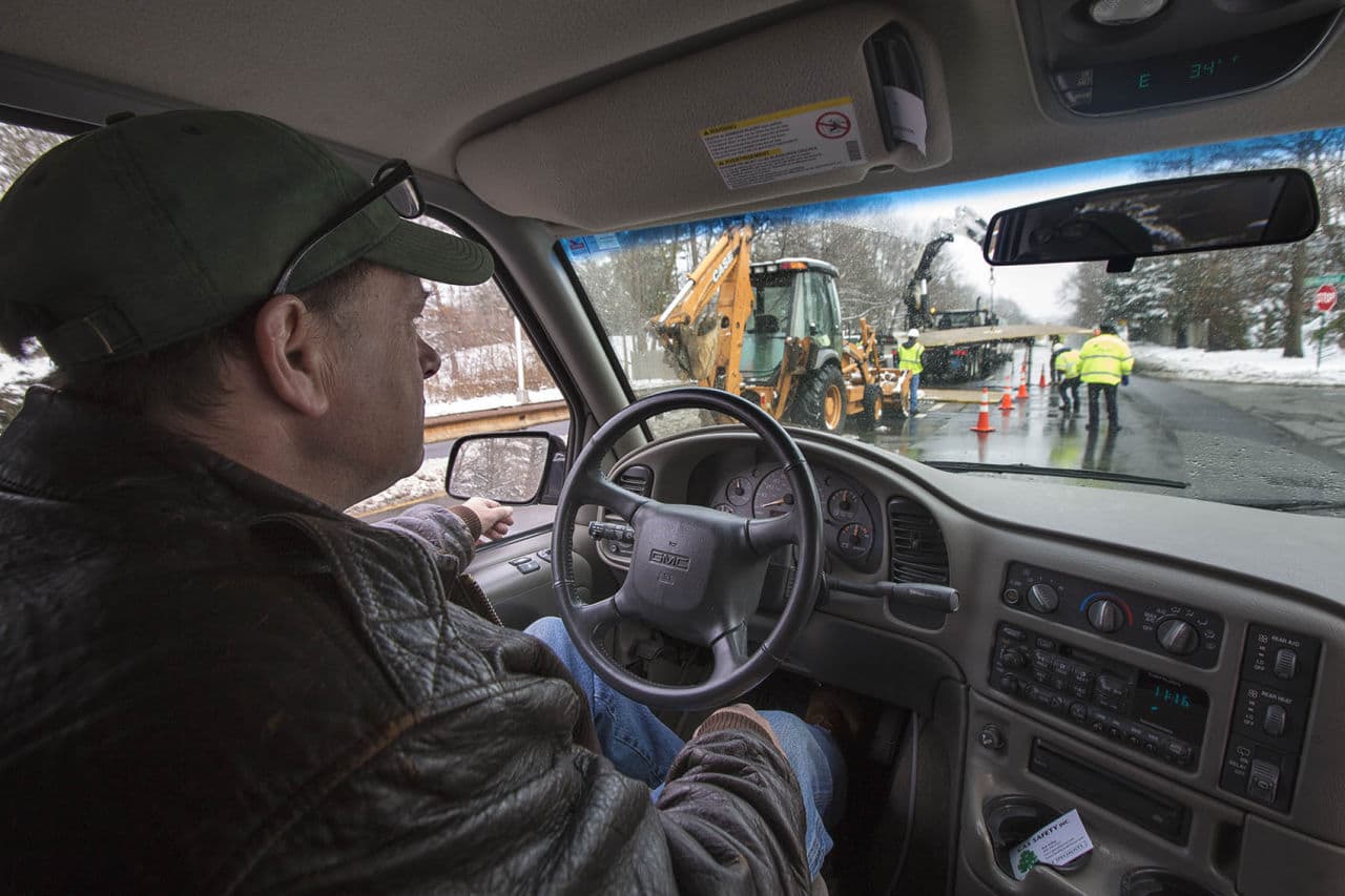 “The gas company is working right up ahead of us right now repairing a leak,” said Bob Ackley, of Gas Safety USA, as he drives a van that is equipped to detect and map methane leaks. Most of the small leaks Ackley detects pose no danger, but unseen and strikingly common, experts estimate they account for 10 percent of all greenhouse gases emitted in the state. (Jesse Costa/WBUR)