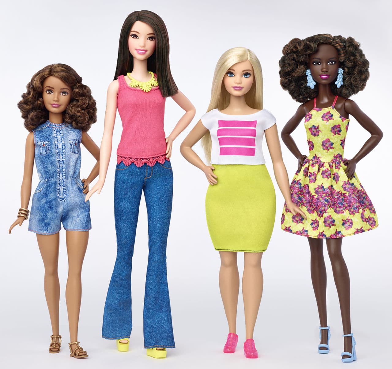 This file photo provided by Mattel shows a group of new Barbie dolls introduced in January 2016. (AP)