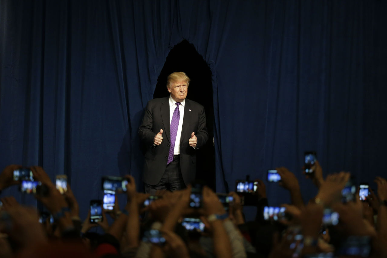 Republican presidential candidate Donald Trump arrives for a caucus night rally Tuesday in Las Vegas. Trump won the state handily and is well ahead of GOP rivals in Massachusetts, according to the WBUR poll. (Jae C. Hong/AP)