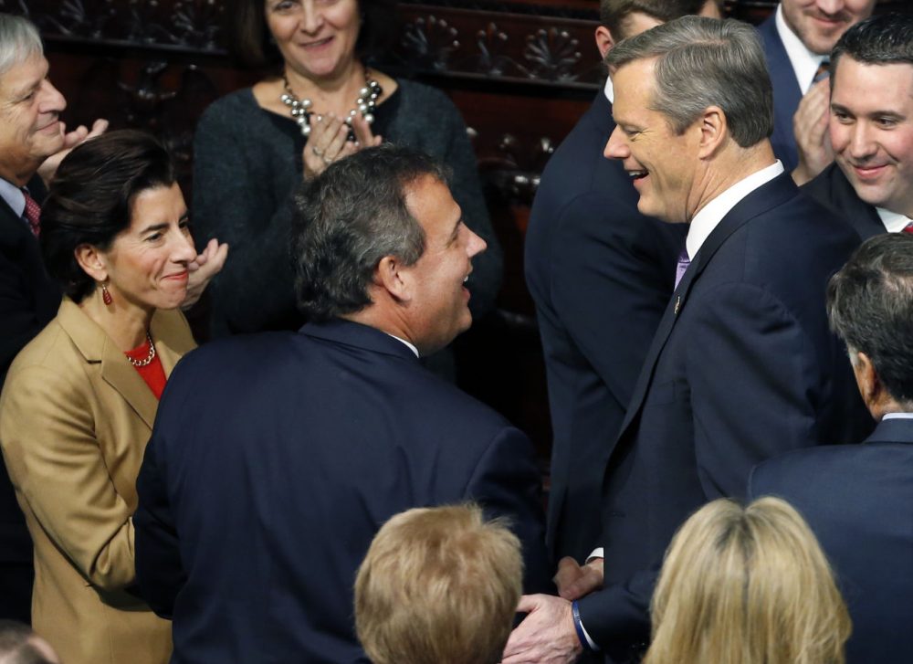 In this January 2015 file photo, Gov. Charlie Baker, right, greets New Jersey Gov. Chris Christie and Rhode Island Gov. Gina Raimondo, far left, at the State House in Boston, prior to Baker's inauguration. (Elise Amendola/AP)