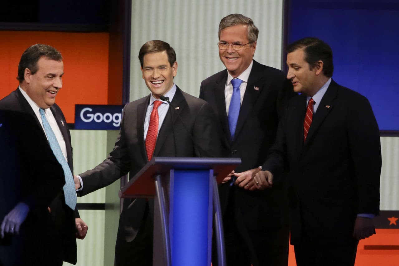 Republican presidential candidates Gov. Chris Christie, Sen. Marco Rubio, former Florida Gov. Jeb Bush and Sen. Ted Cruz, talk after a debate on Jan. 28 in Des Moines, Iowa. (Charlie Neibergall/AP)