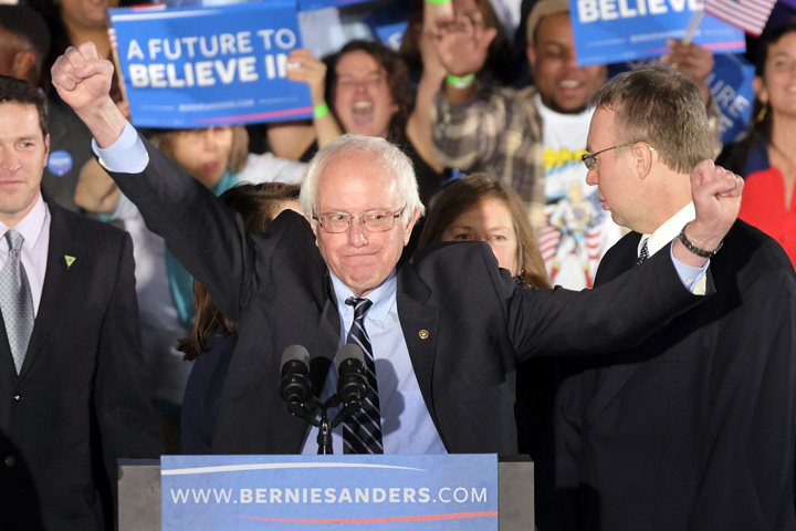 Democratic presidential candidate, Sen. Bernie Sanders, I-Vt., reacts to the cheering crowd at his primary night rally Tuesday, Feb. 9, 2016, in Manchester, N.H. (AP Photo/J. David Ake)
