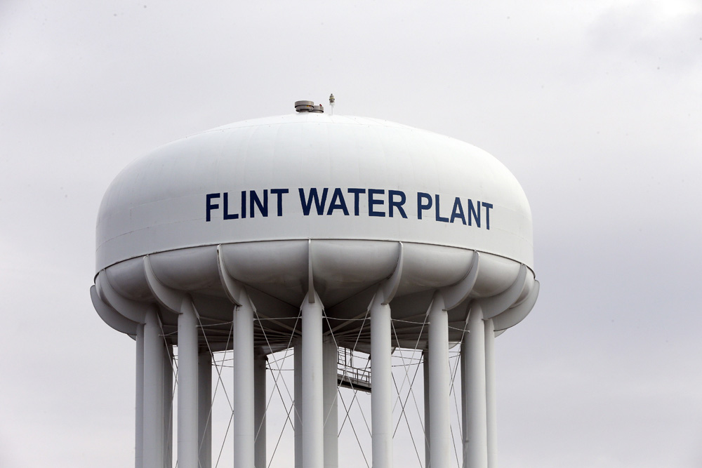 The Flint Water Plant tower is seen, Friday, Feb. 5, 2016 in Flint, Mich. Flint is under a public health emergency after its drinking water became tainted when the city switched from the Detroit system and began drawing from the Flint River in April 2014 to save money. The city was under state management at the time. (AP Photo/Carlos Osorio)