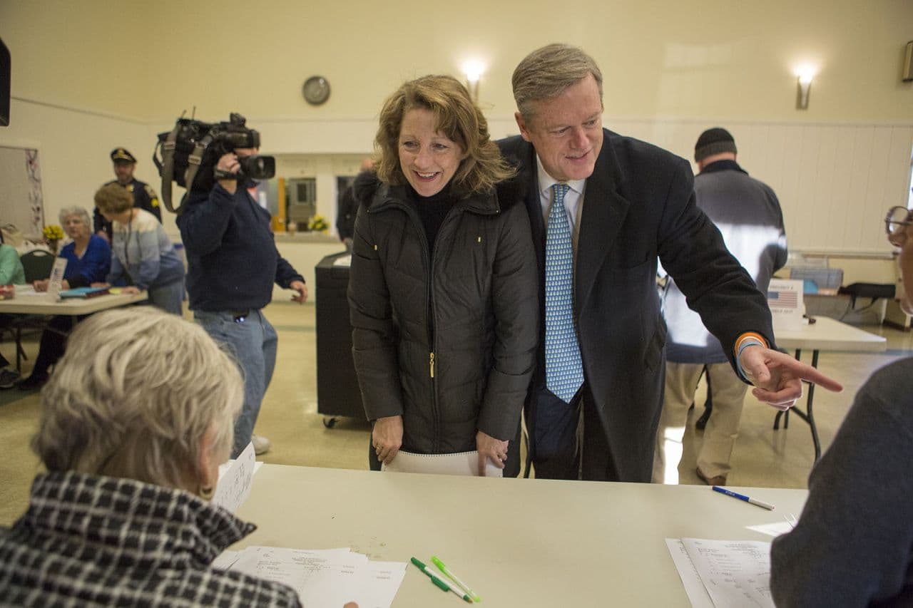 Massachusetts Governor Charlie Baker and his wife Lauren checking in to vote on Super Tuesday. (Jesse Costa/WBUR)