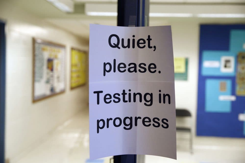 In this photo taken Jan. 17, 2016, a sign is seen at the entrance to a hall for a college test preparation class at Holton Arms School. The current version of the SAT college entrance exam is having its final run, when thousands of students nationwide will sit, squirm or stress through the nearly four-hour reading, writing and math test. A new revamped version debuts in March. (Alex Brandon/AP)