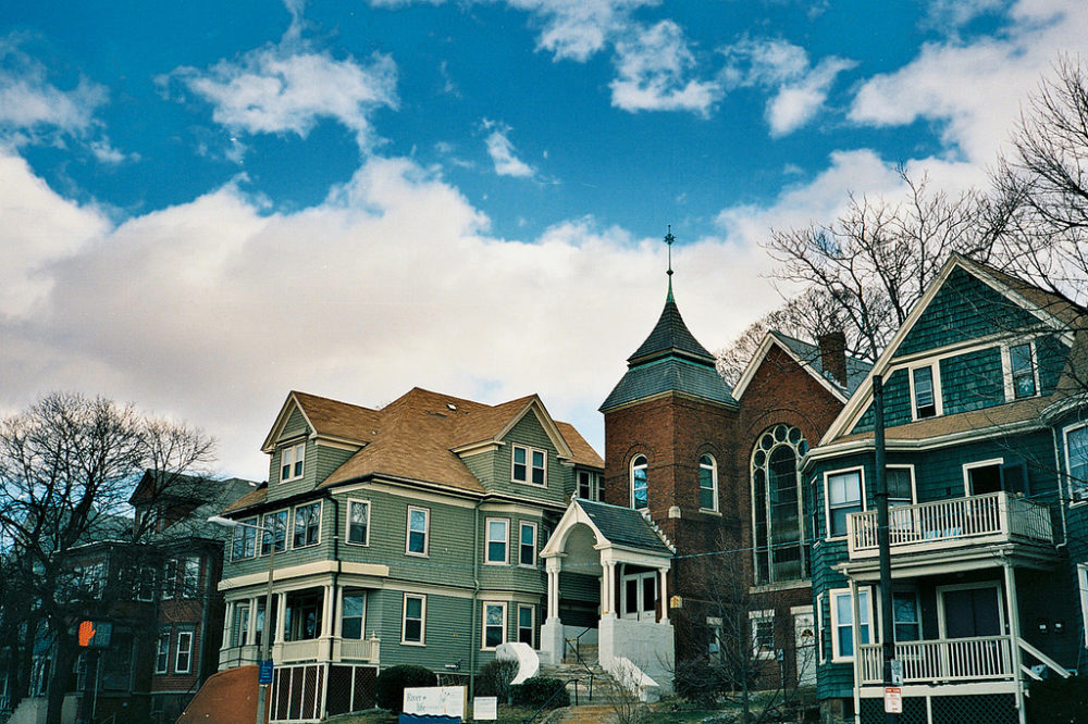 A cluster of homes and buildings in the city's Jamaica Plain neighborhood. The city's new pilot plan calls for the construction of more densely built homes that are affordable to middle-income families in Jamaica Plain, Roxbury and South Boston. (Soe Lin/Flickr)