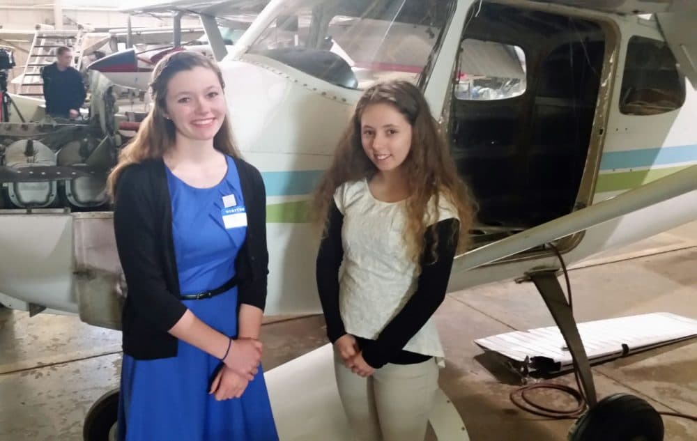 Emma Gay (left) and Anna Leya Fields are helping restore the 1950s Cessna 172 back to its former glory. (Jacob Ryan)