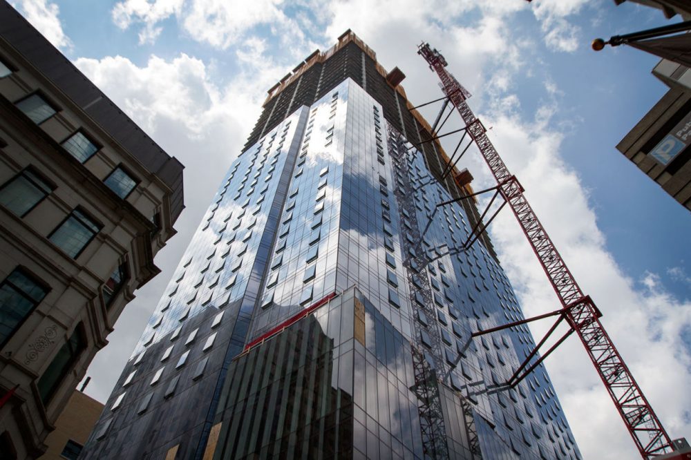 The Millennium Tower is seen undergoing construction in Boston in July 2015. (Hadley Green for WBUR)