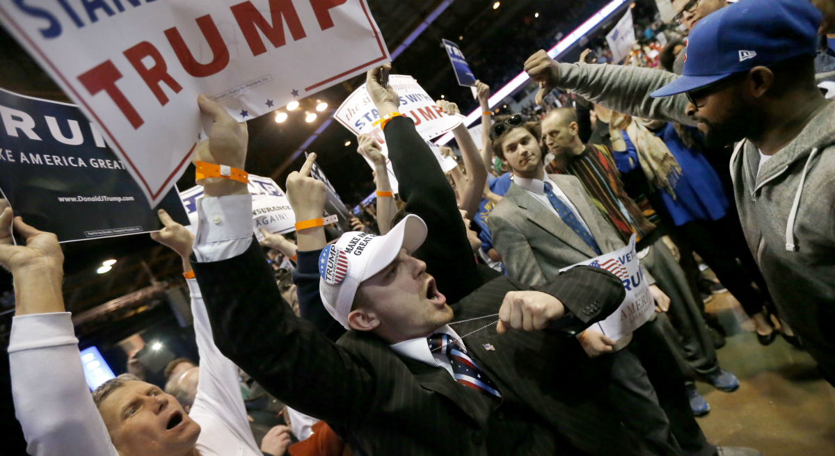 Steve Almond: "What scares me about all this isn’t just that the Presidential front-runner of the Republican Party appears eager to foment civil unrest, but that the networks are so desperate for ratings that they’ve become his de facto enablers." Pictured: Supporters of Republican presidential candidate Donald Trump, left, face off with protesters after a rally on the campus of the University of Illinois-Chicago was cancelled due to security concerns Friday, March 11, 2016, in Chicago. (Charles Rex Arbogast/AP)