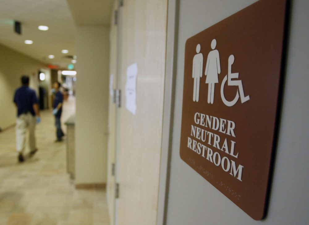 Gov. Charlie Baker won't say whether he supports the bill, which would expand anti-discrimination protections for transgender people from the areas of housing and employment to include public accommodations -- such as gender-segregated restrooms. Here, a sign marks the entrance to a gender-neutral restroom at the University of Vermont in Burlington, Vermont. (Toby Talbot/AP/File)