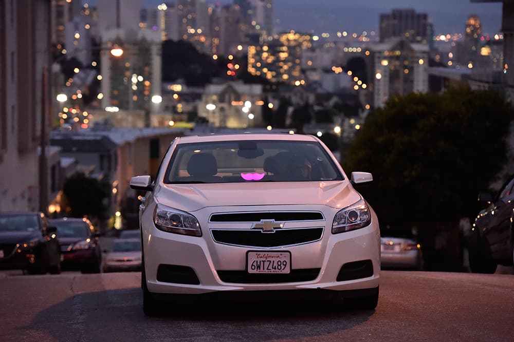 A Lyft Glowstache glows on the dashboard of a car in San Francisco on Feb. 03. (Josh Edelson/AP Images for Lyft)