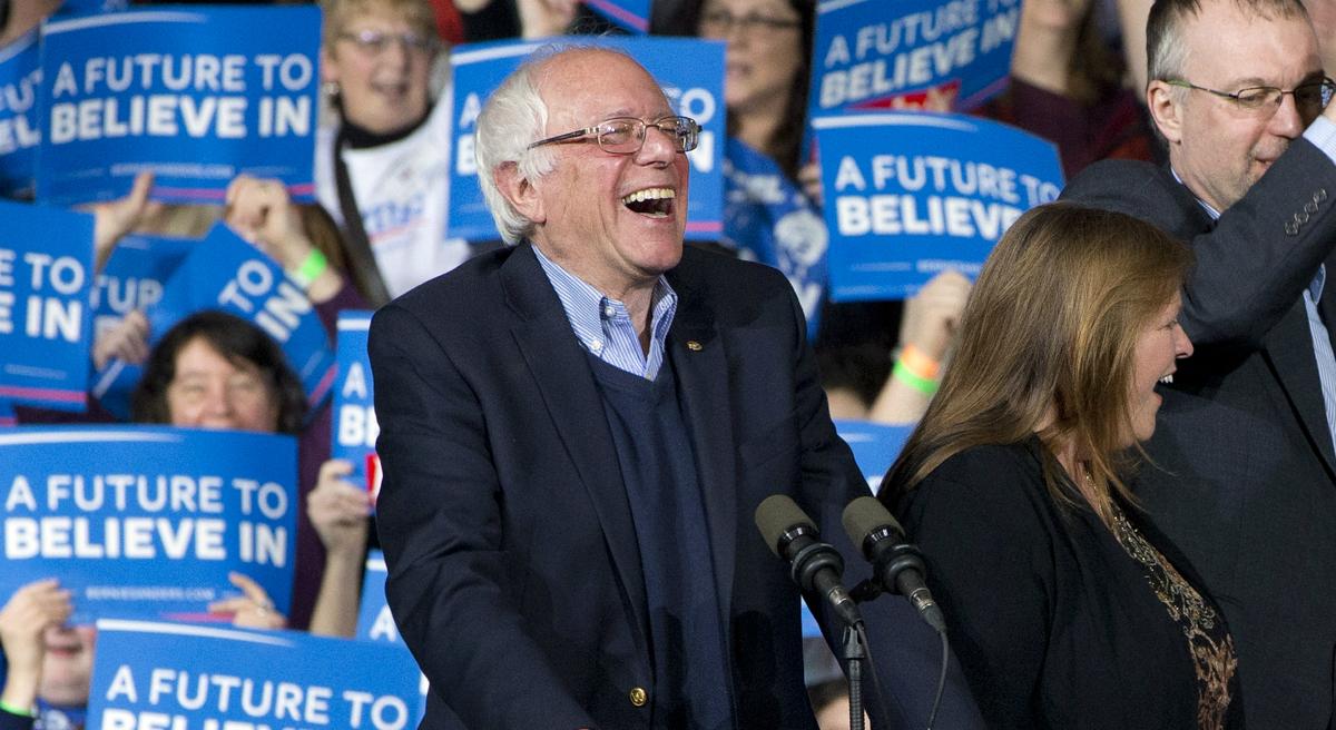 Democratic presidential candidate Sen. Bernie Sanders, I-Vt., laughs as he arrives with his wife Jane Sanders, and his son Levi Sanders to a primary night rally in Essex Junction, Vt., Tuesday, March 1, 2016, on Super Tuesday. (Jacquelyn Martin/AP)