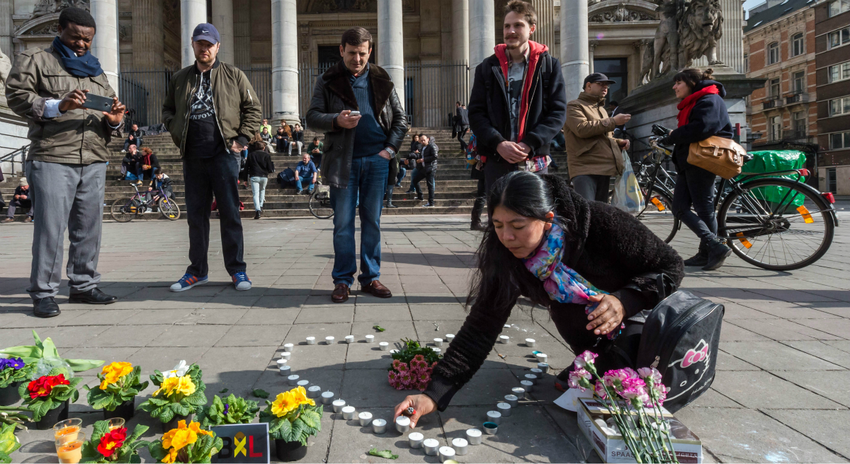 Mark Edington: "The coincidence of our week of remembrance and Resurrection with the horrors of bombs and blood confronts us with a perplexing sorrow." Pictured: A woman places candles in the shape of a heart outside the stock exchange in Brussels on Tuesday, March 22, 2016. (Geert Vanden Wijngaert/AP)