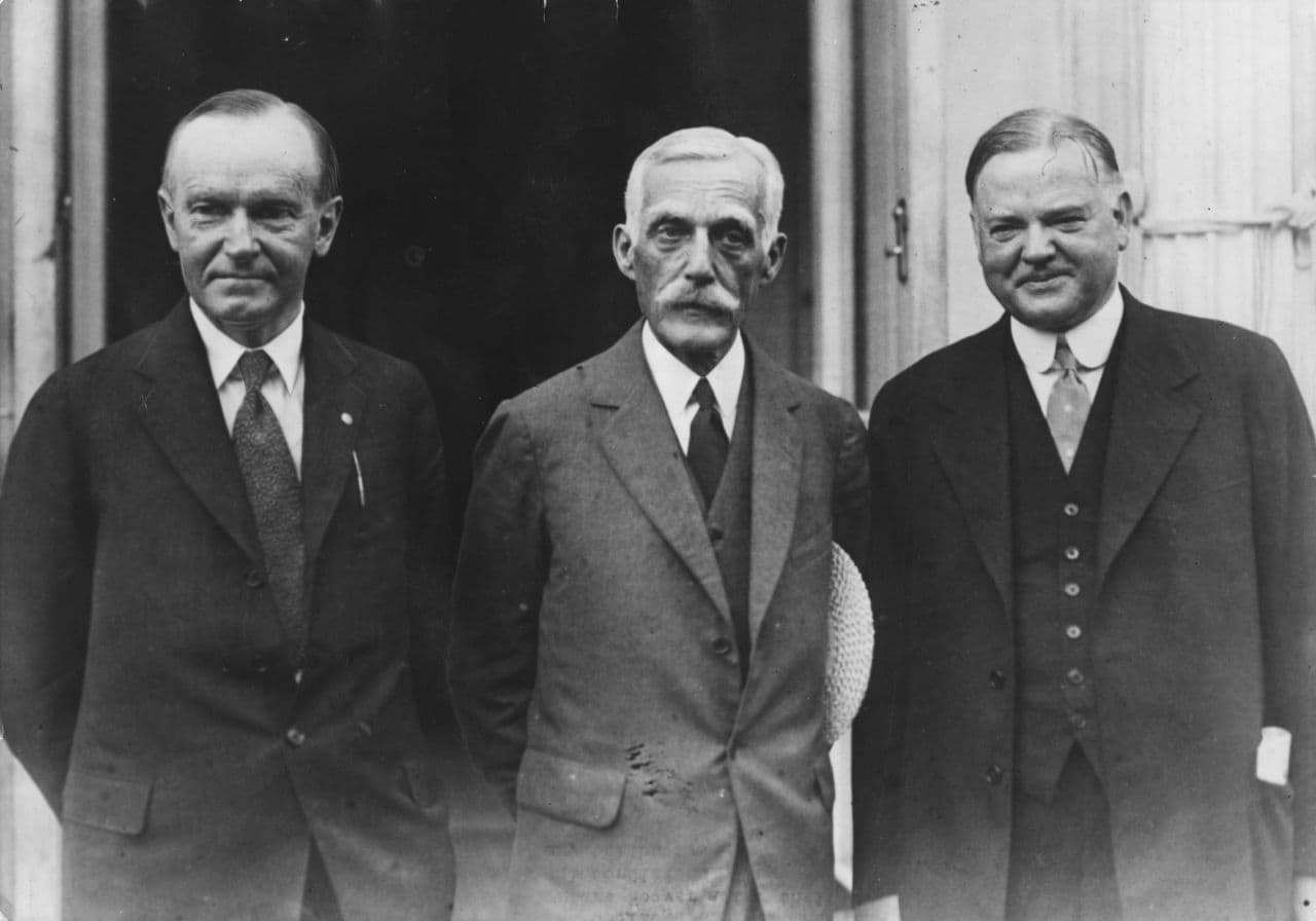 American President Calvin Coolidge (1872 - 1933) with Secretary of the Treasury Andrew Mellon (1855 - 1937) and future President Herbert Hoover (1874 - 1964) outside the White House after discussions. Original Publication: People Disc - HC0289 (Photo by Keystone/Getty Images)