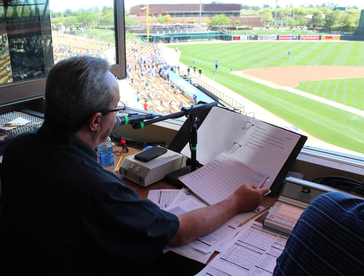 Jeff Scott reading announcements in the press box at Camelback Ranch in Glendale, Arizona. (Casey Kuhn/KJZZ)
