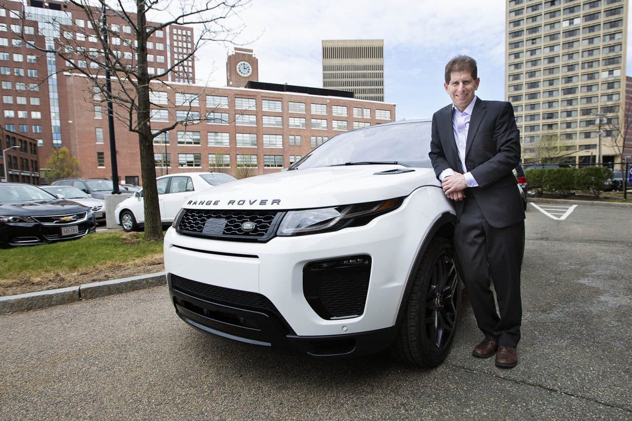 MIT's Bryan Reimer stands with a Range Rover Evoque that is outfitted with many driverless features. (Jesse Costa/WBUR)