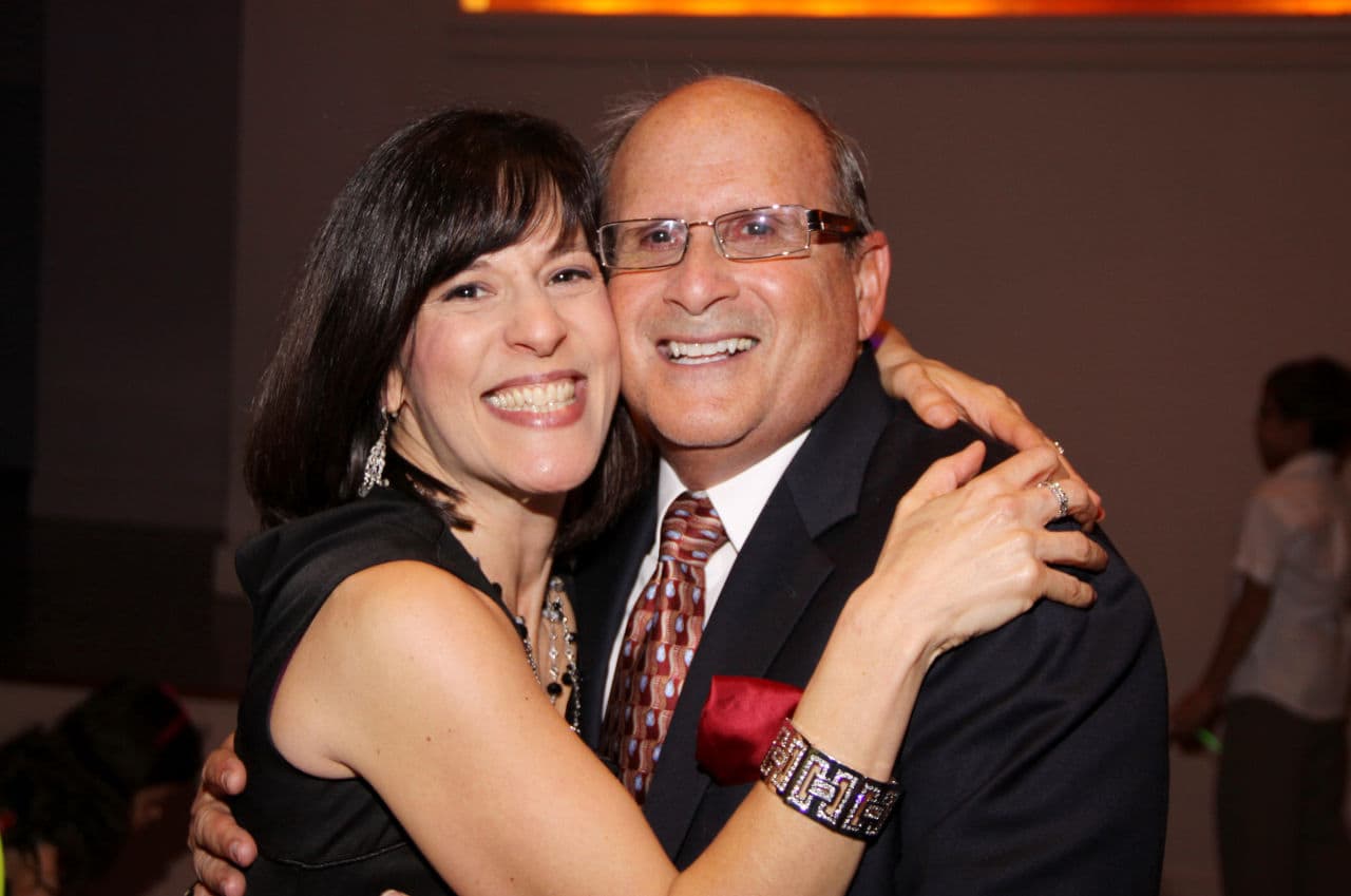 Deborah Greene, left, says this is one of her favorite pictures of her father because it was taken in "a moment of bliss." They're on the dance floor at her daughter's bat mitzvah. (Courtesy of Deborah Greene)