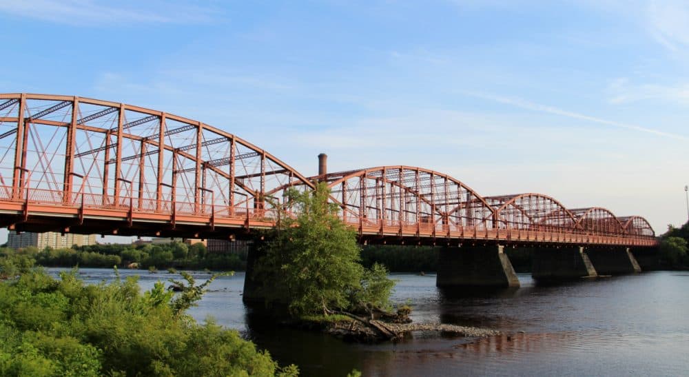The historic Aiken Street Bridge over the Merrimack River in Lowell, Massachusetts. (cmh2315fl/Flickr)