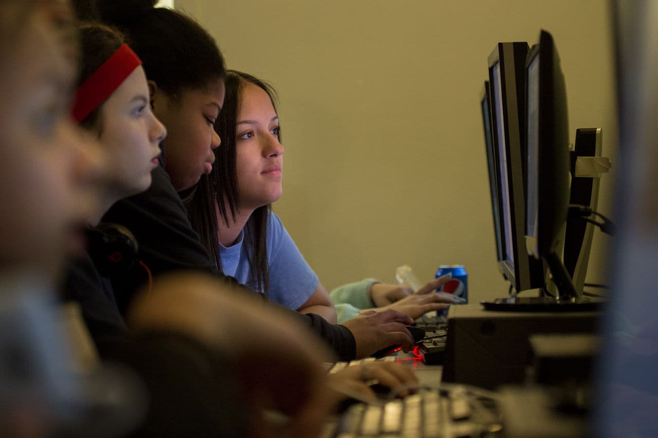 Girls of the Brookview House Girls Who Code Club learn programming skills in a basement in Roxbury. (Jesse Costa/WBUR)