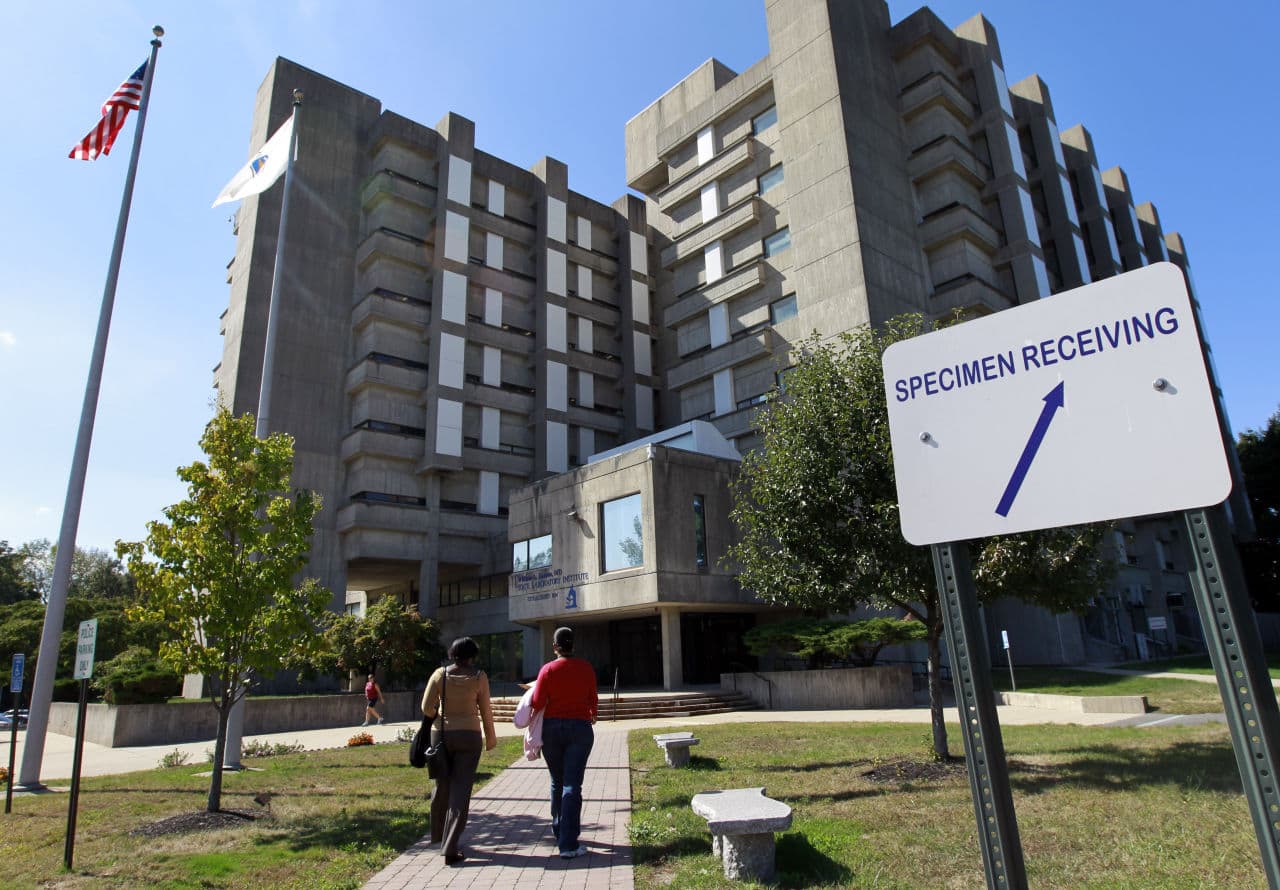 Passers-by approach the William A. Hinton State Laboratory Institute, where a crime lab chemist spent years faking results. A second case of misconduct by a state chemist was reported by Attorney General Maura Healey Wednesday. (Steven Senne/AP)