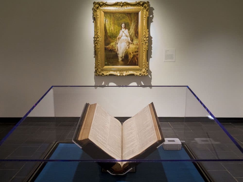 The First Folio is on display at the Mead Art Museum in Amherst College. Hanging on the wall behind is Thomas Dicksee’s &quot;Ophelia.&quot; (Andrea Shea/WBUR)