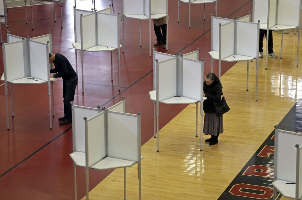 In North Reading, Mass., voters cast ballots at a polling station for Massachusetts' primary election held in March. (Elise Amendola/AP)