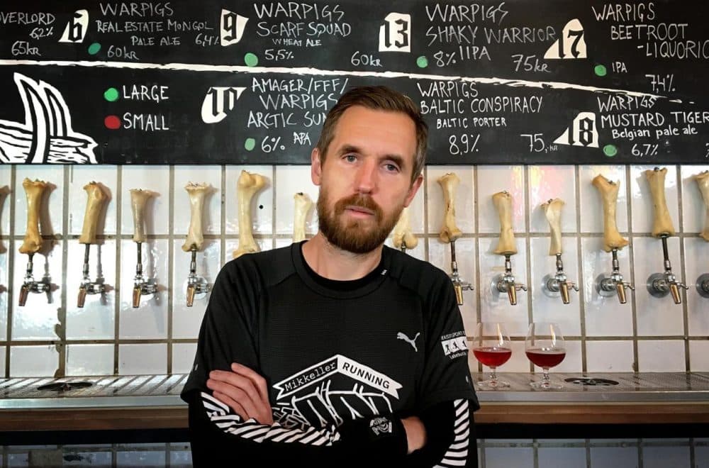 Mikkel Borg Bjergsø is the brewer behind Mikkeller Beer -- a popular line of brews found throughout Europe. Bjergsø is bringing one of his unique concoctions to this weekend's Boston Calling music festival. (Andrea Shea/WBUR)