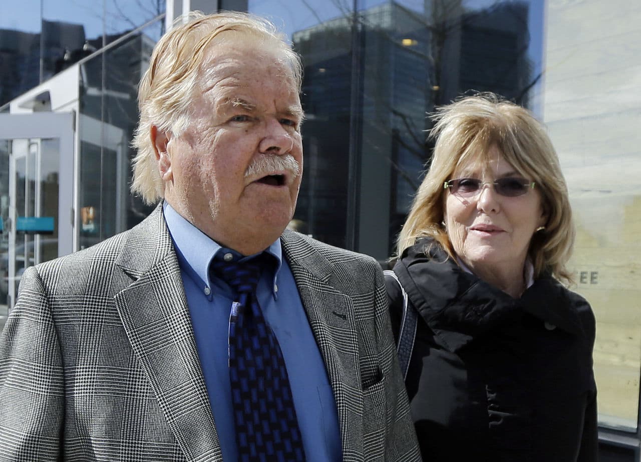 Robert Fitzpatrick walks from federal court in Boston in April 2015, accompanied by his wife, Jane. (Elise Amendola/AP)