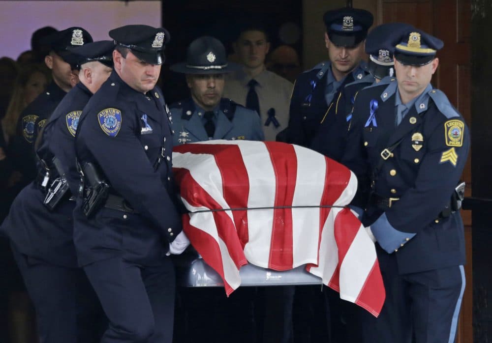 Pallbearers carry the casket of Ronald Tarentino out of St. Joseph's Church Friday in Charlton. (Elise Amendola/AP)