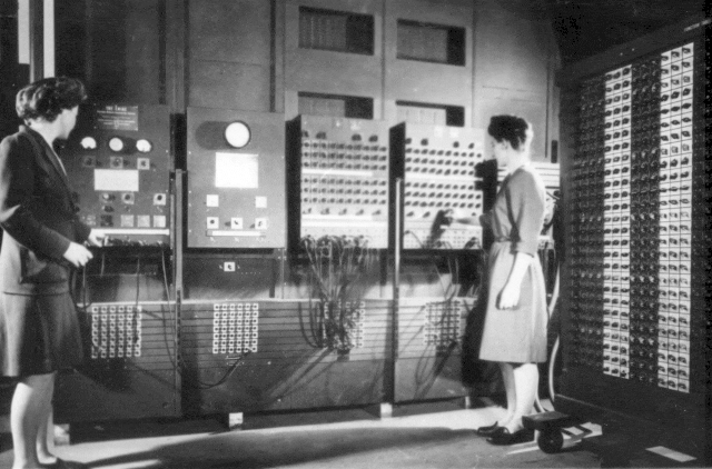 Programmers Betty Jean Jennings, left, and Fran Bilas operate ENIAC's main control panel at the Moore School of Electrical Engineering. (U.S. Army photo from the archives of the ARL Technical Library)