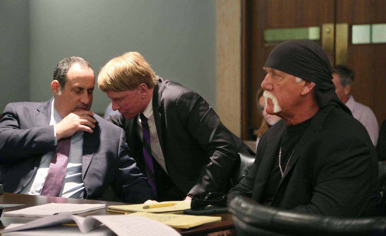 Attorneys Kenneth Turkel and David Houston confer as their client Hulk Hogan, whose real name is Terry Bollea, appears in court, Wednesday, May 25, 2016, in St. Petersburg, Fla. A Florida judge on Wednesday denied Gawker's motion for a new trial in Hogan's sex-video case and won't reduce a $140 million jury verdict. (Scott Keeler/The Tampa Bay Times via AP, Pool)