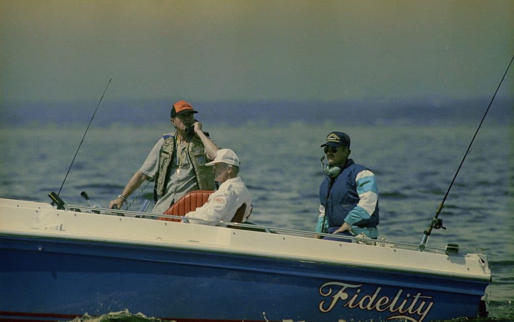 President Bush, left, aboard his boat, Fidelity, during a fishing trip with National Security Advisor Brent Scowcroft, center, near his vacation home in Kennebunkport, Maine on July 28, 1990. (Elise Amendola/AP)