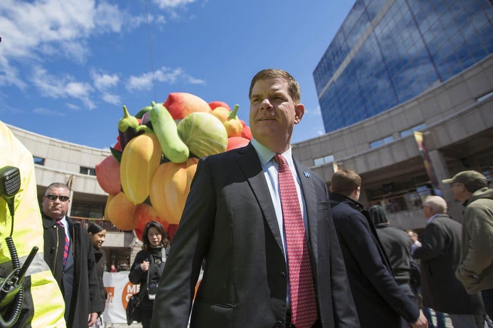 Boston Mayor Marty Walsh in Faneuil Hall in front of Choi Jeong Hwa's &quot;Fruit Tree.&quot; The tree was inflated in April as part of the MFA's Megacities exhibition. (Jesse Costa/WBUR)
