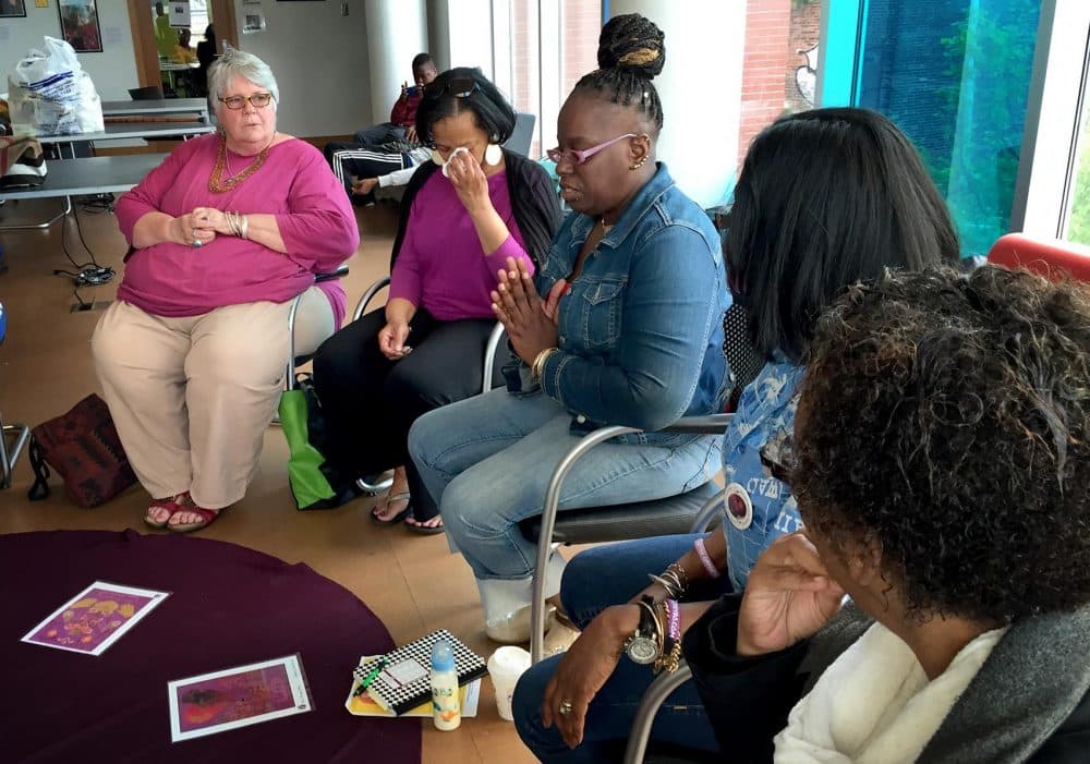 Homicide loss survivors take turns sharing memories and feelings with the other group members. (Lynn Jolicoeur/WBUR)